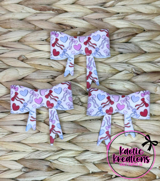 (DISCONTINUED) BEADABLE JUMBO SILICONE BOW HEARTS AND BOWS (1ct)