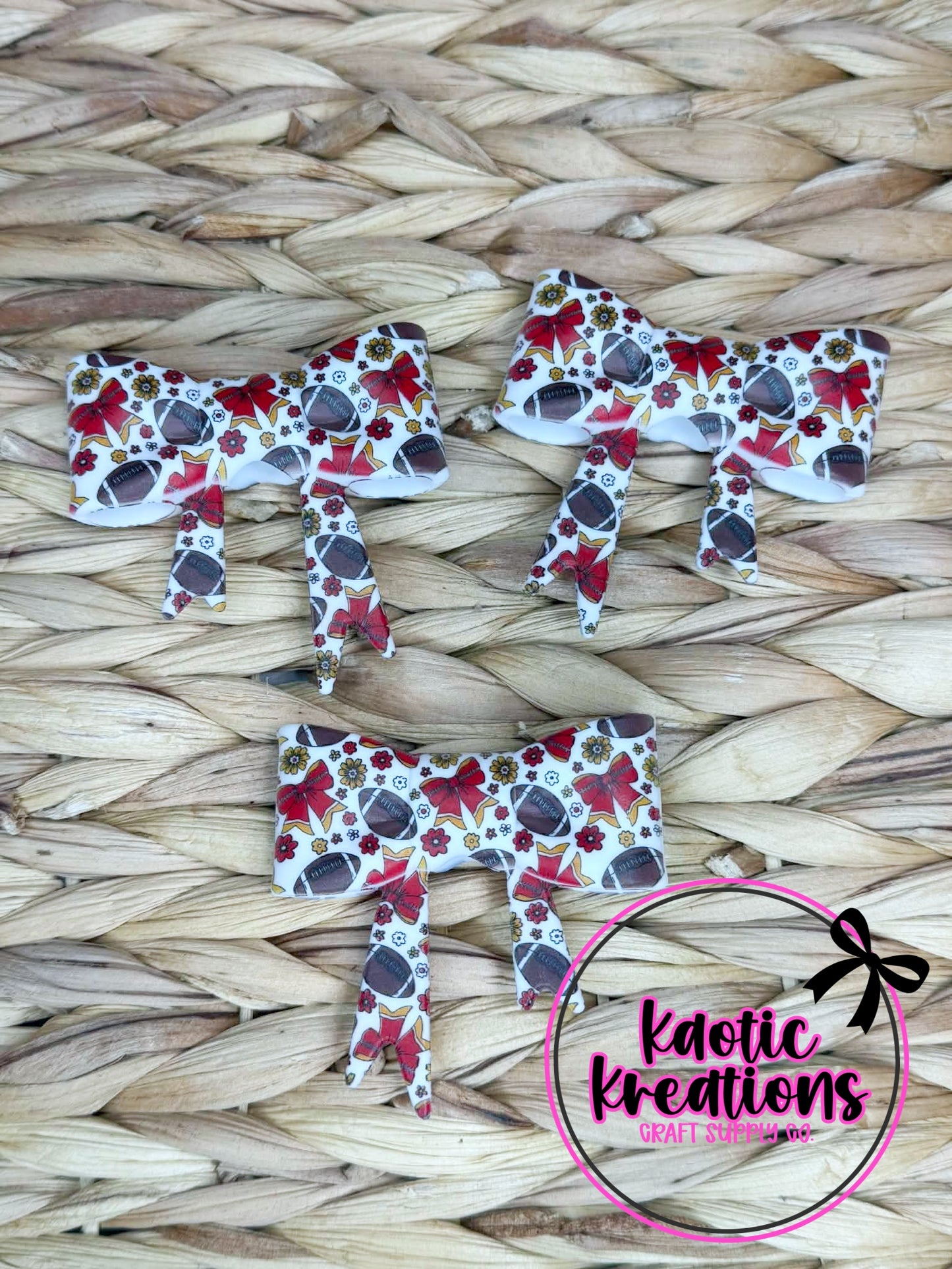 (DISCONTINUED) BEADABLE JUMBO SILICONE BOW RED BOWS AND FOOTBALLS (1ct)